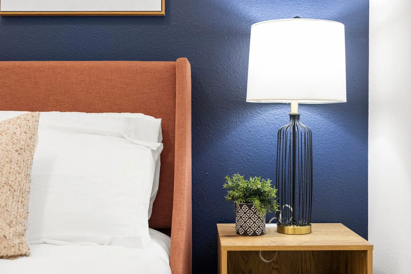 Tranquil bedroom with soft bedding and ample closet space, designed to ensure a restful night's sleep.