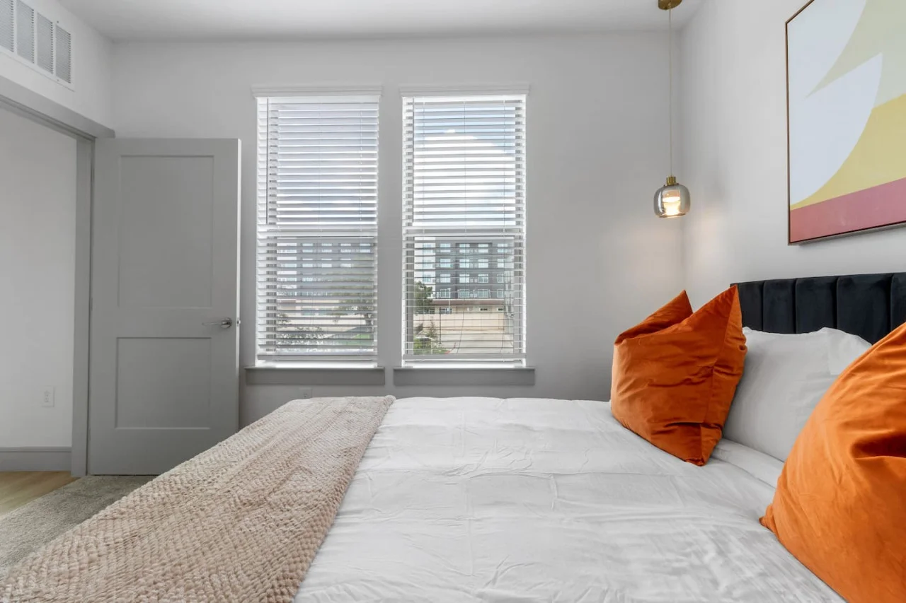 The bedroom offers a luxurious retreat, with a bed that promises restful nights and a room that feels like a private oasis.