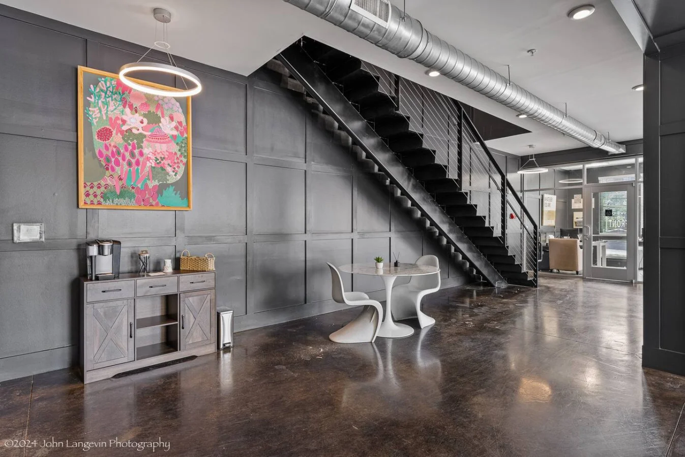 You feel a sense of continuity as you climb the stairs, moving seamlessly between the different levels of the home.