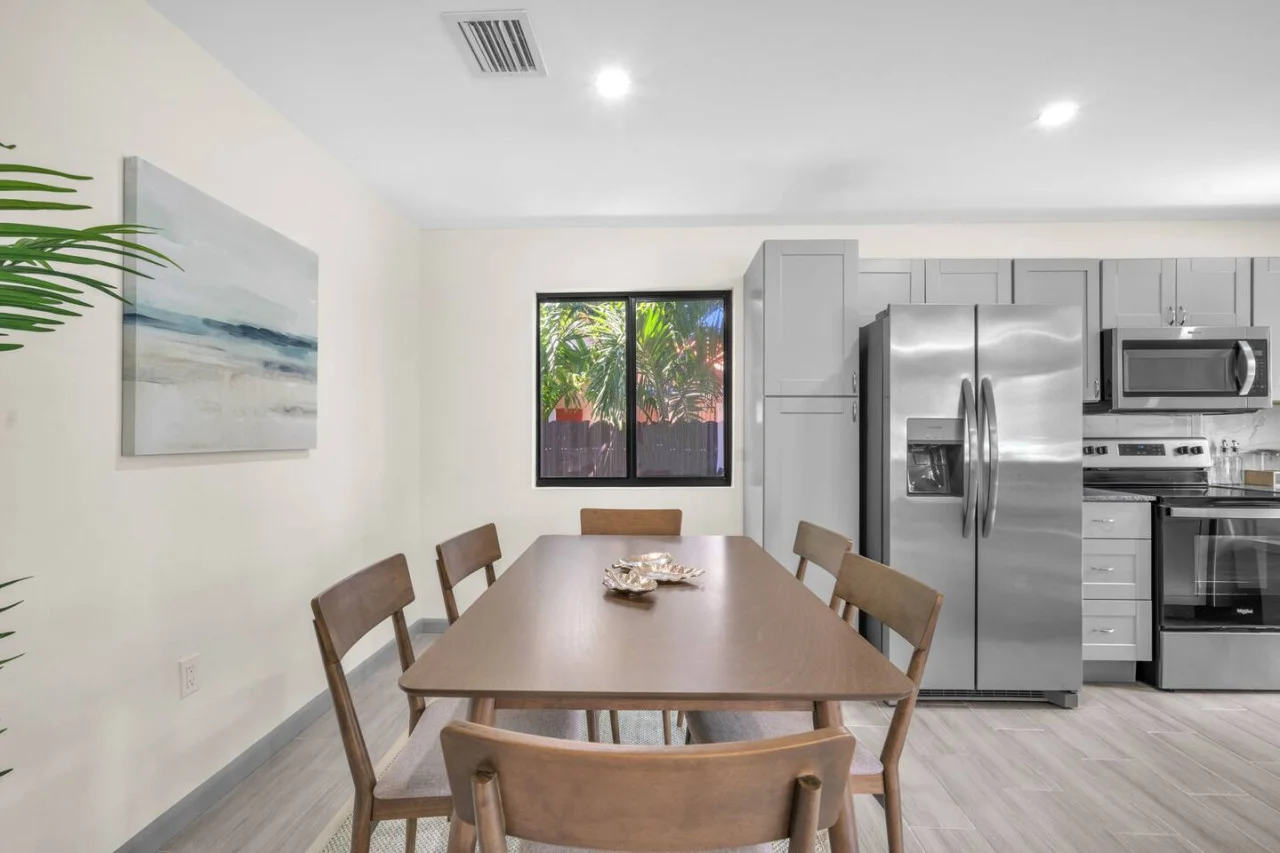 Big long dining table that fits 6 with comfortable chairs.