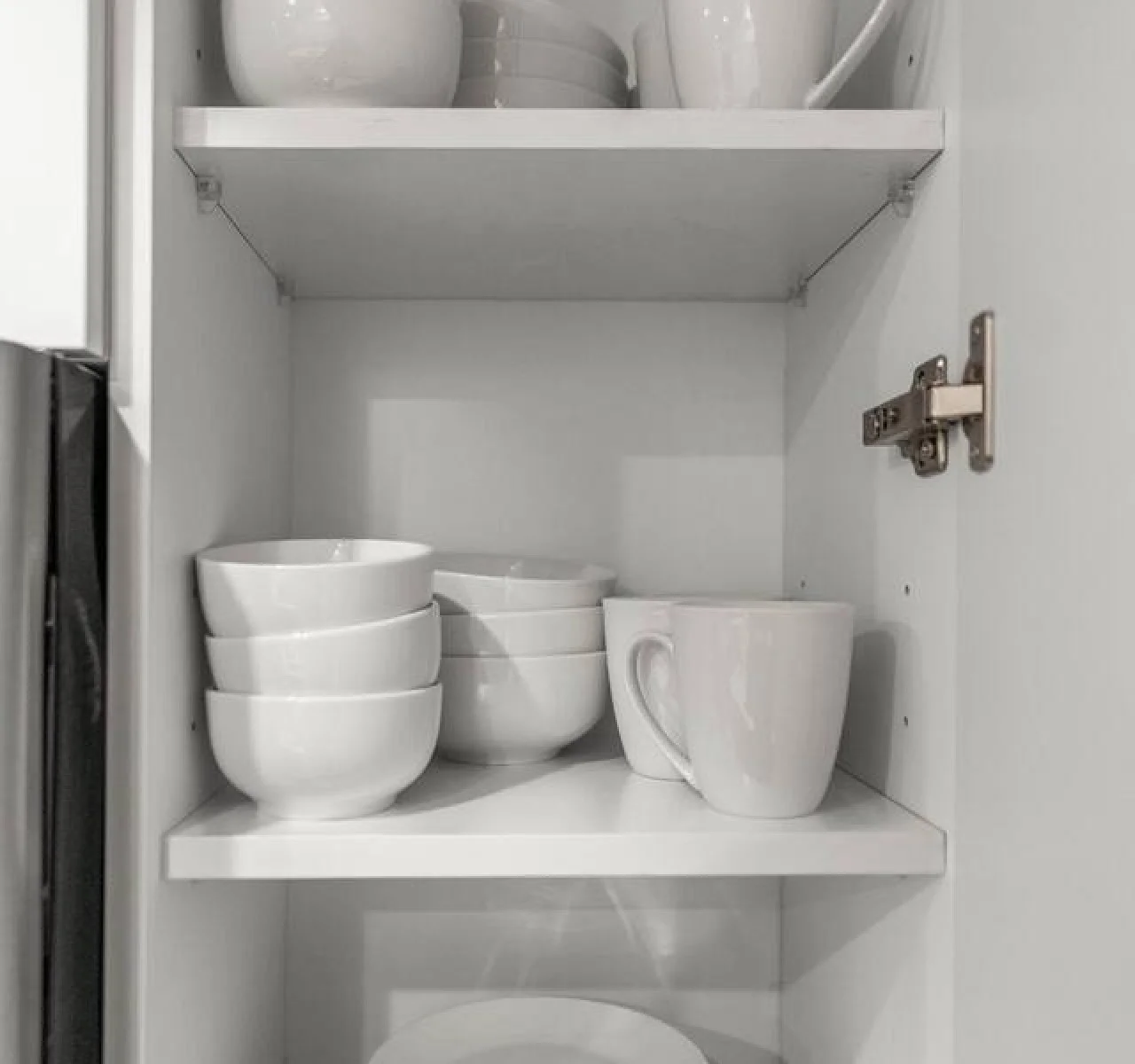 Kitchen cabinets stocked with cooking wares, glassware and silverwares, ideal for mixing up your favorite meals and drinks during your stay.