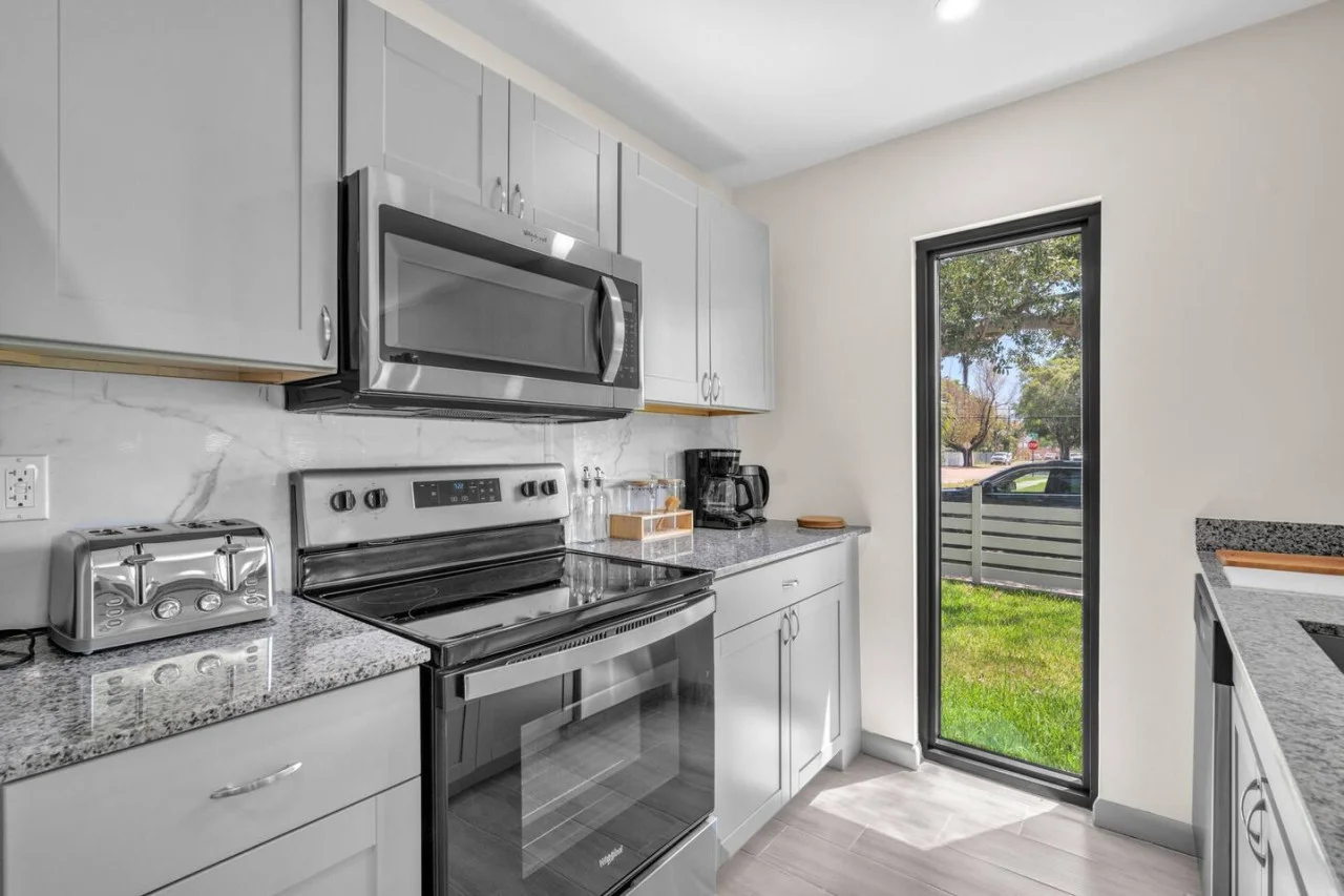 The kitchen’s open layout allows you to move freely as you prepare meals, with everything you need at your fingertips.