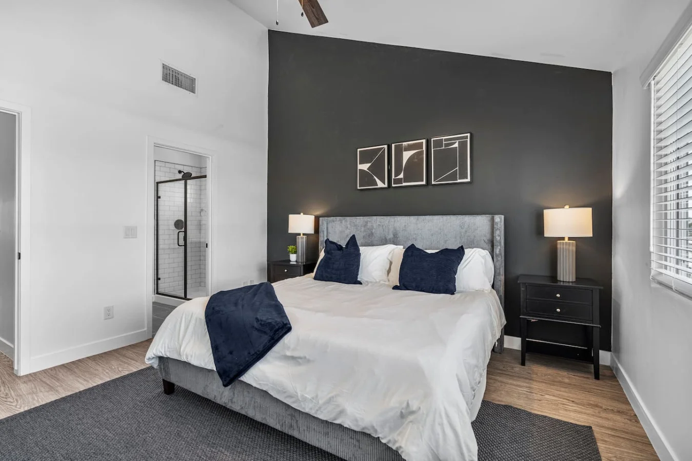 The bedroom’s serene ambiance invites you to relax, with a plush bed that promises a restful night's sleep.