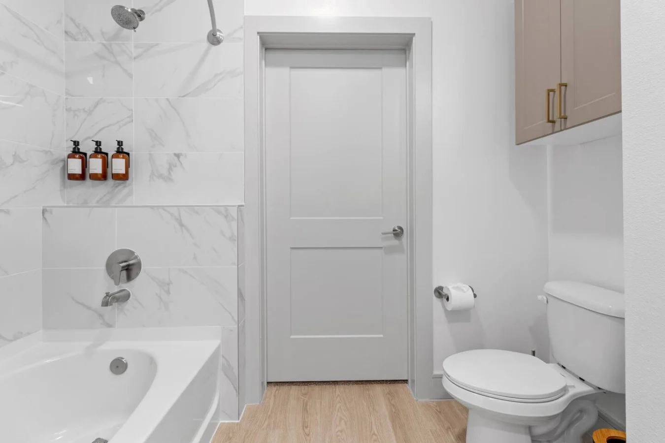 The bathroom welcomes you with calm sophistication, combining thoughtful design and luxurious finishes for a serene escape.