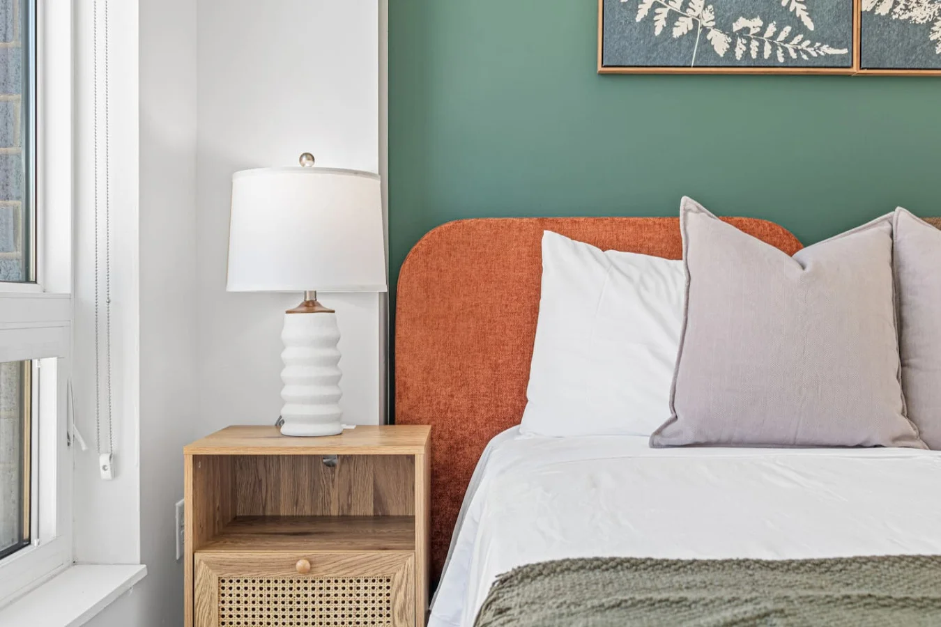 The bedroom offers a luxurious retreat, with a bed that promises restful nights and a room that feels like a private oasis.