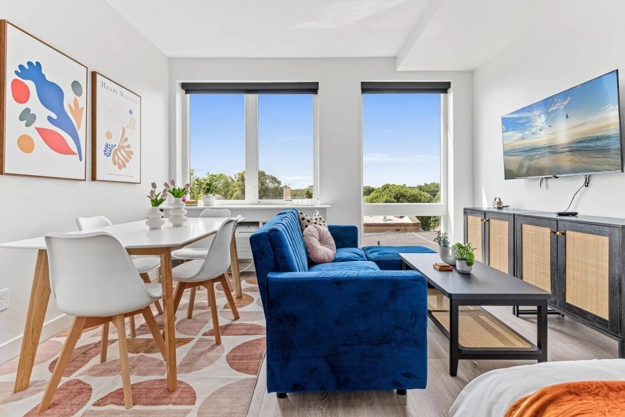 Relax in this warm, inviting space with wooden accents and cozy furnishings. You’ll love unwinding on the plush sofa, enjoying a good book or streaming your favorite shows in a serene atmosphere