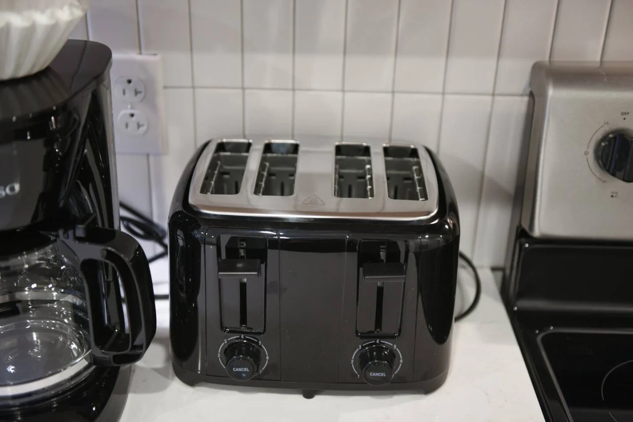 The coffee station is thoughtfully equipped with a variety of in-house consumables, including a selection of ground coffee, sweeteners, and creamers to suit every taste.