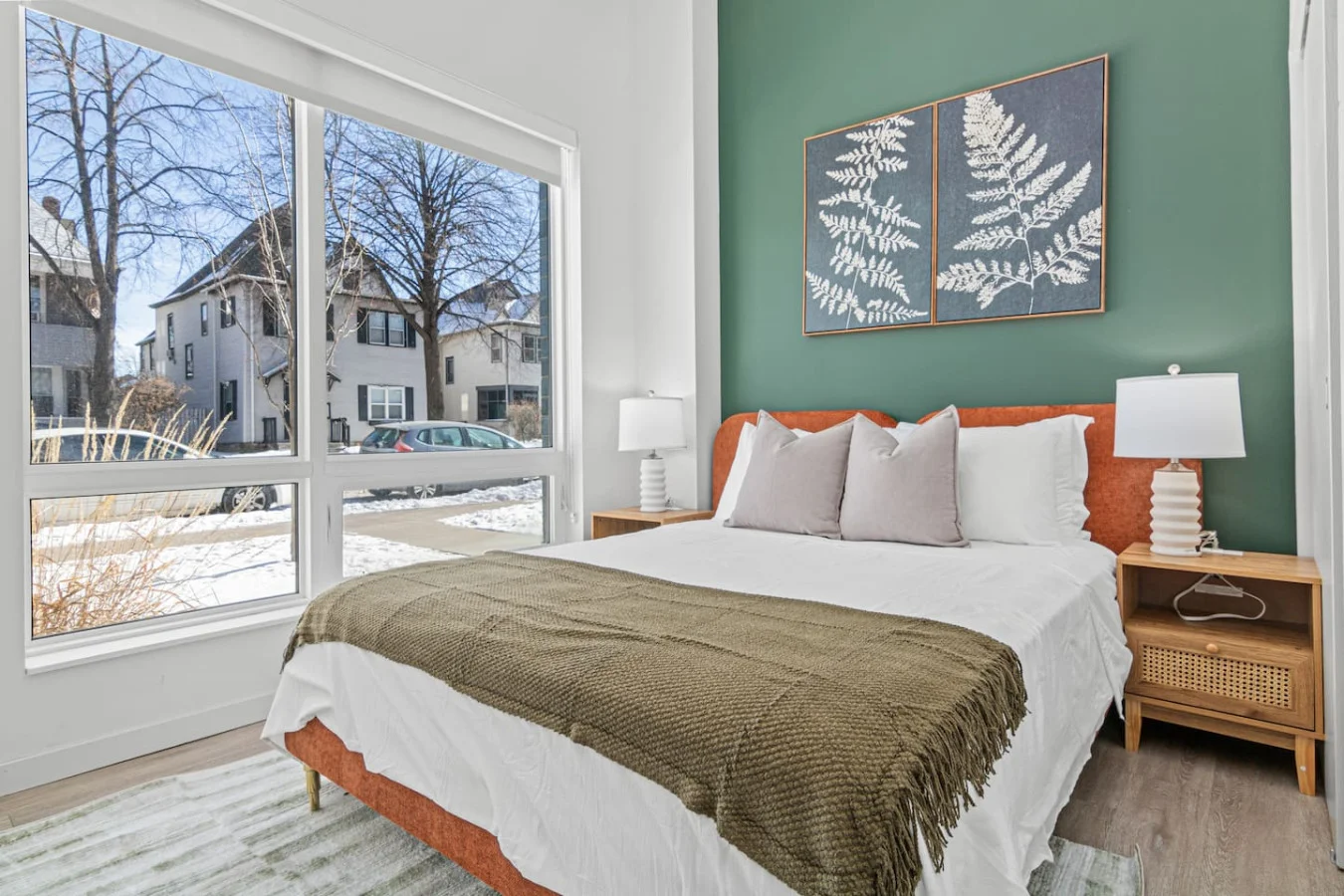 You feel enveloped in comfort as you relax on the queen bed, surrounded by a room designed for tranquility.