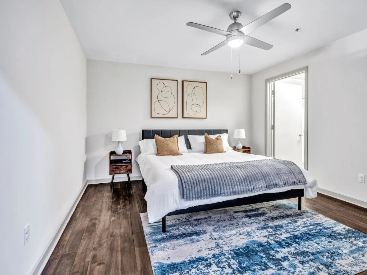 You feel enveloped in comfort as you relax on the queen bed, surrounded by a room designed for tranquility.
