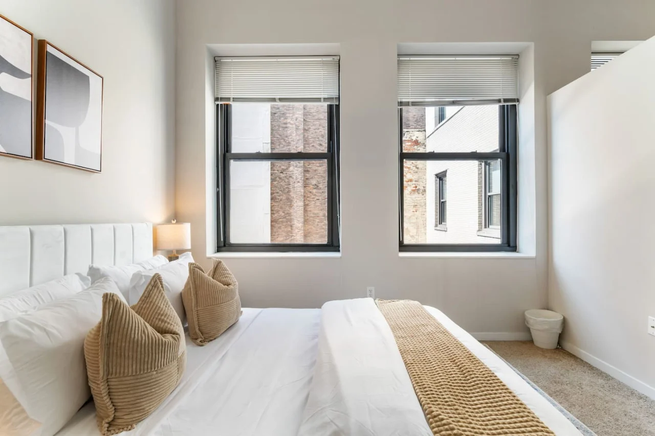 The bedroom’s serene ambiance invites you to relax, with a plush bed that promises a restful night's sleep.