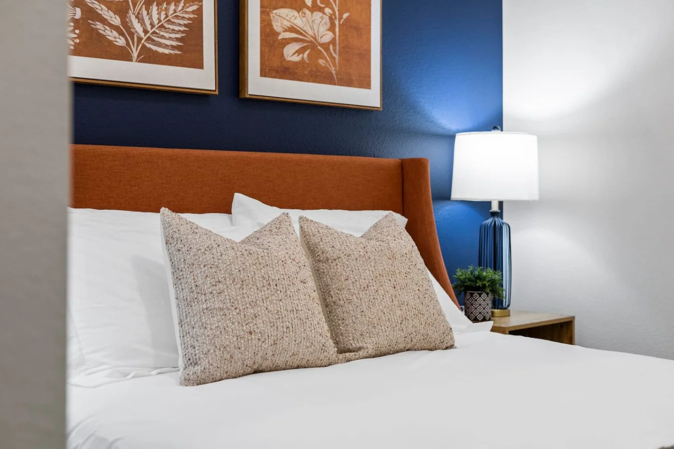 The bedroom offers a luxurious retreat, with a bed that promises restful nights and a room that feels like a private oasis.