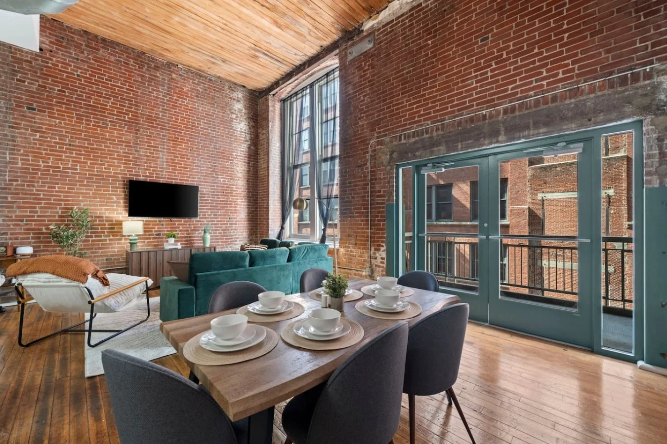 Enjoy dining in this bright open space next to your own private balcony