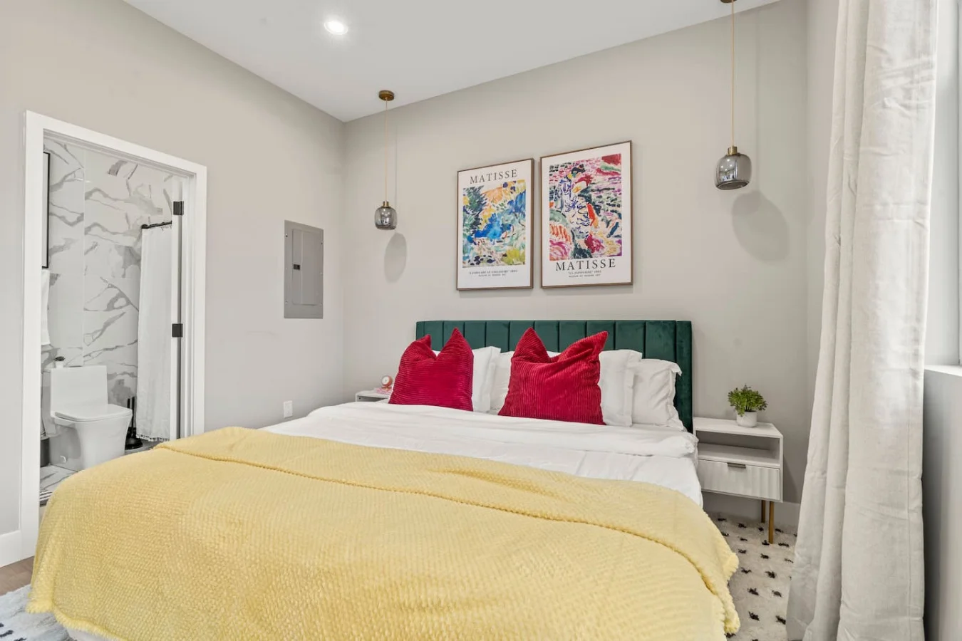 Spacious bedroom with stylish decor, perfect for unwinding after a day of exploring the local area.