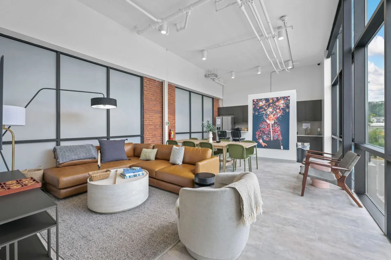 The living room is filled with natural light, creating a bright and welcoming space that invites relaxation.