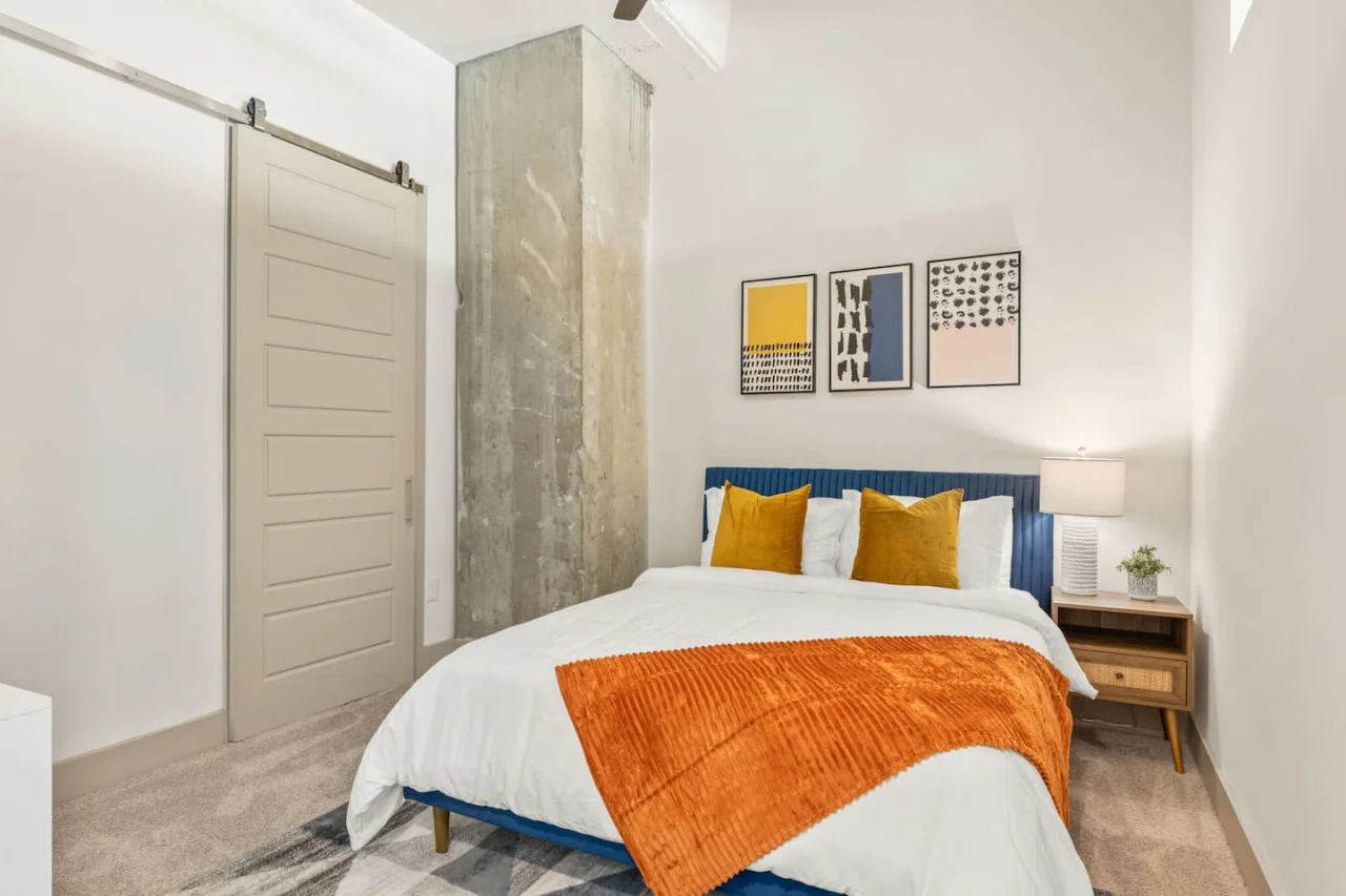 Luxurious bedroom featuring a comfortable bed, elegant decor, and plenty of natural light for a rejuvenating sleep.