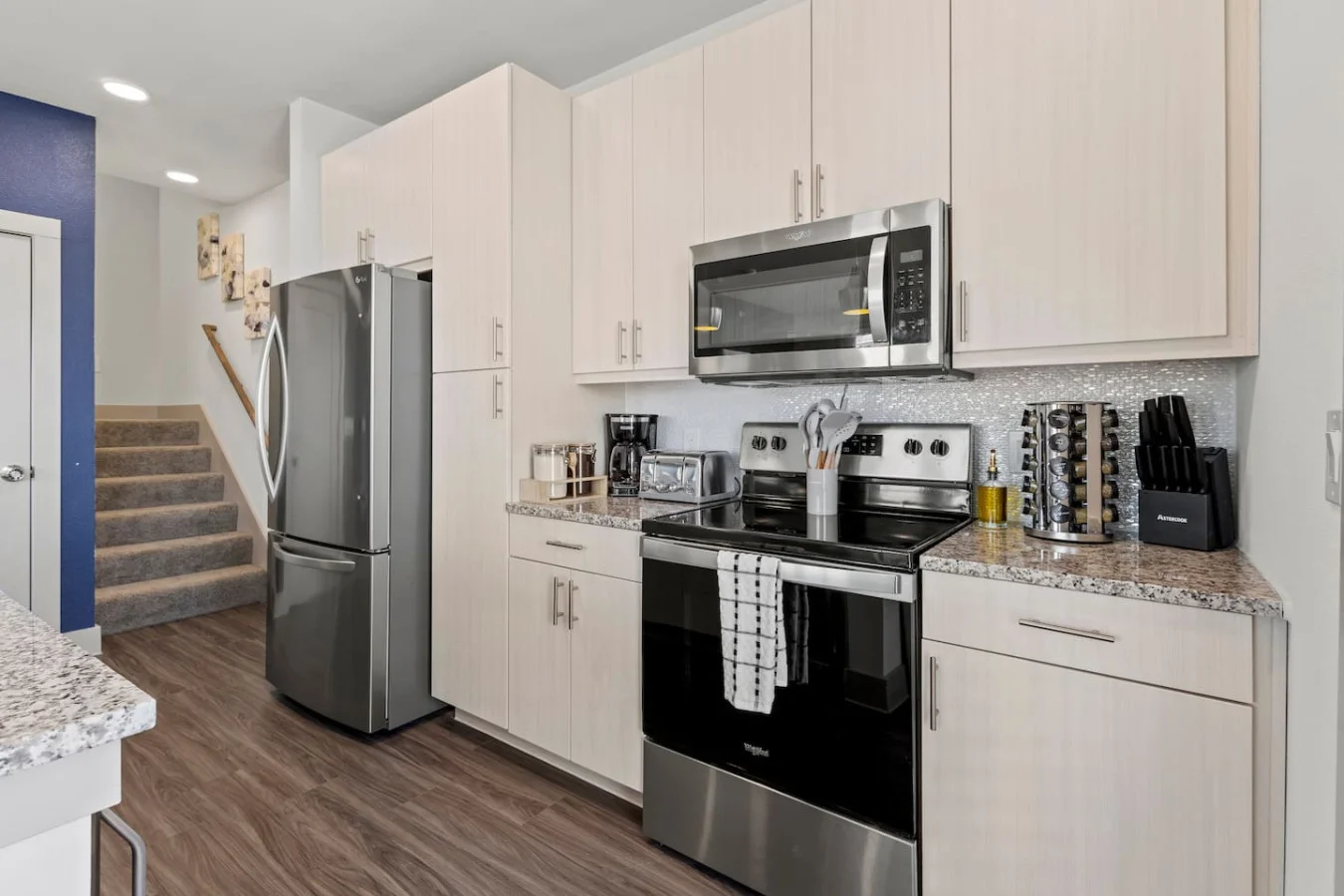 As you open the kitchen, you discover an assortment of coffee pods, and sugar, ensuring you have everything you need for a perfect morning or afternoon pick-me-up.