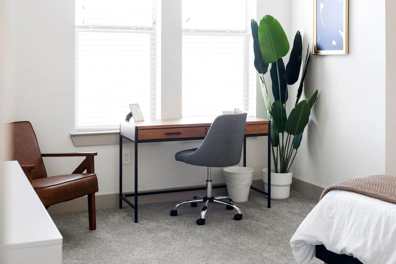 This cozy workspace with warm lighting, and a creative wall display, perfect for productivity.