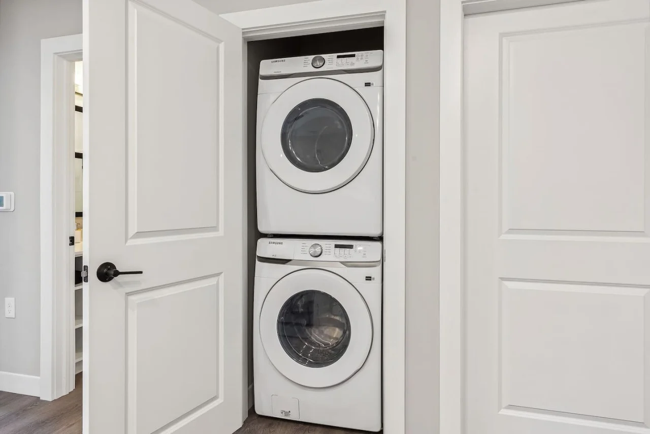 Convenient laundry room with washer, dryer, and all necessary supplies, making it easy to take care of your laundry needs.