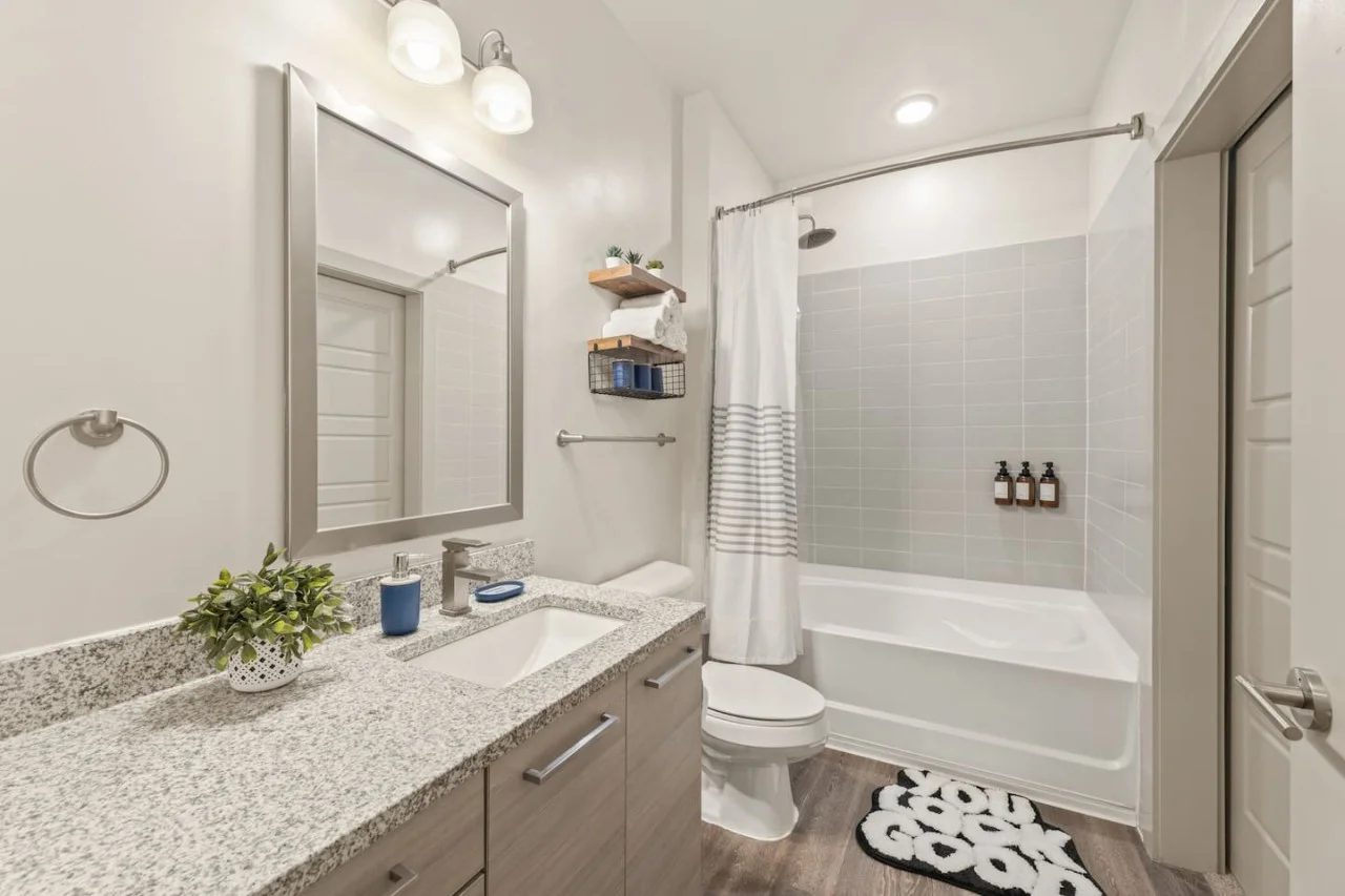 Experience a spa-like retreat in this beautifully appointed bathroom, featuring a full tub, modern fixtures, and thoughtful details. Refresh and rejuvenate with our luxury toiletries and plush towels.