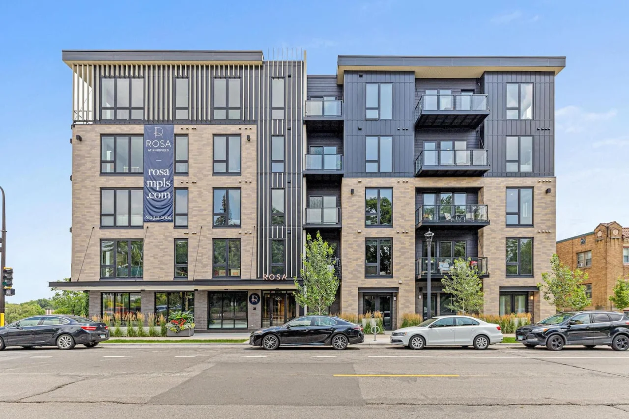 Street view of the Building - Front entrance - Street Parking - Trees.