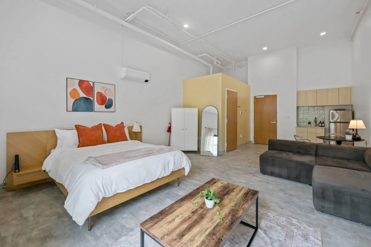 The bedroom offers a luxurious retreat, with a bed that promises restful nights and a room that feels like a private oasis.