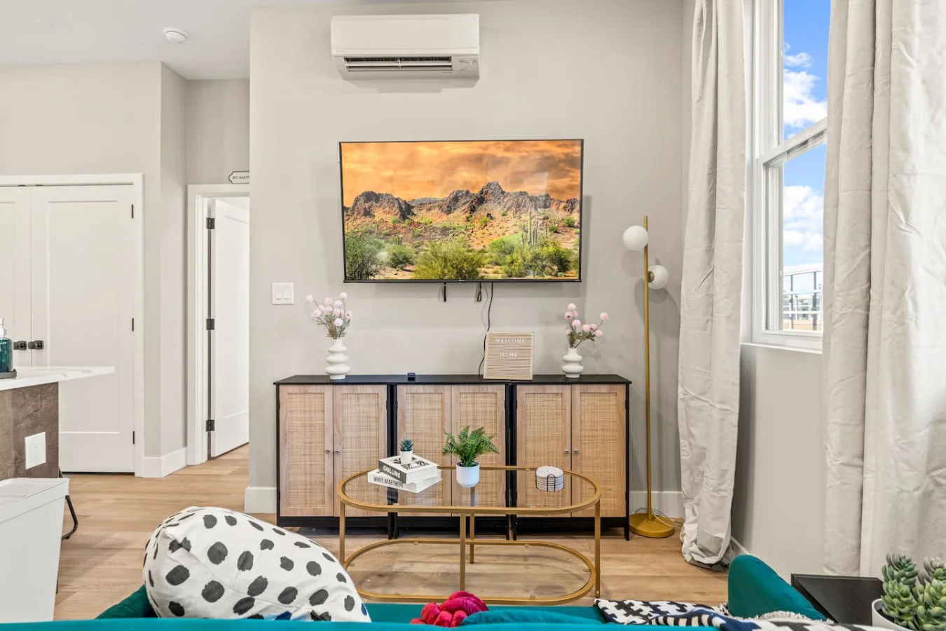 The living room’s cozy vibe makes it the perfect spot to relax, with ample seating and a warm ambiance.