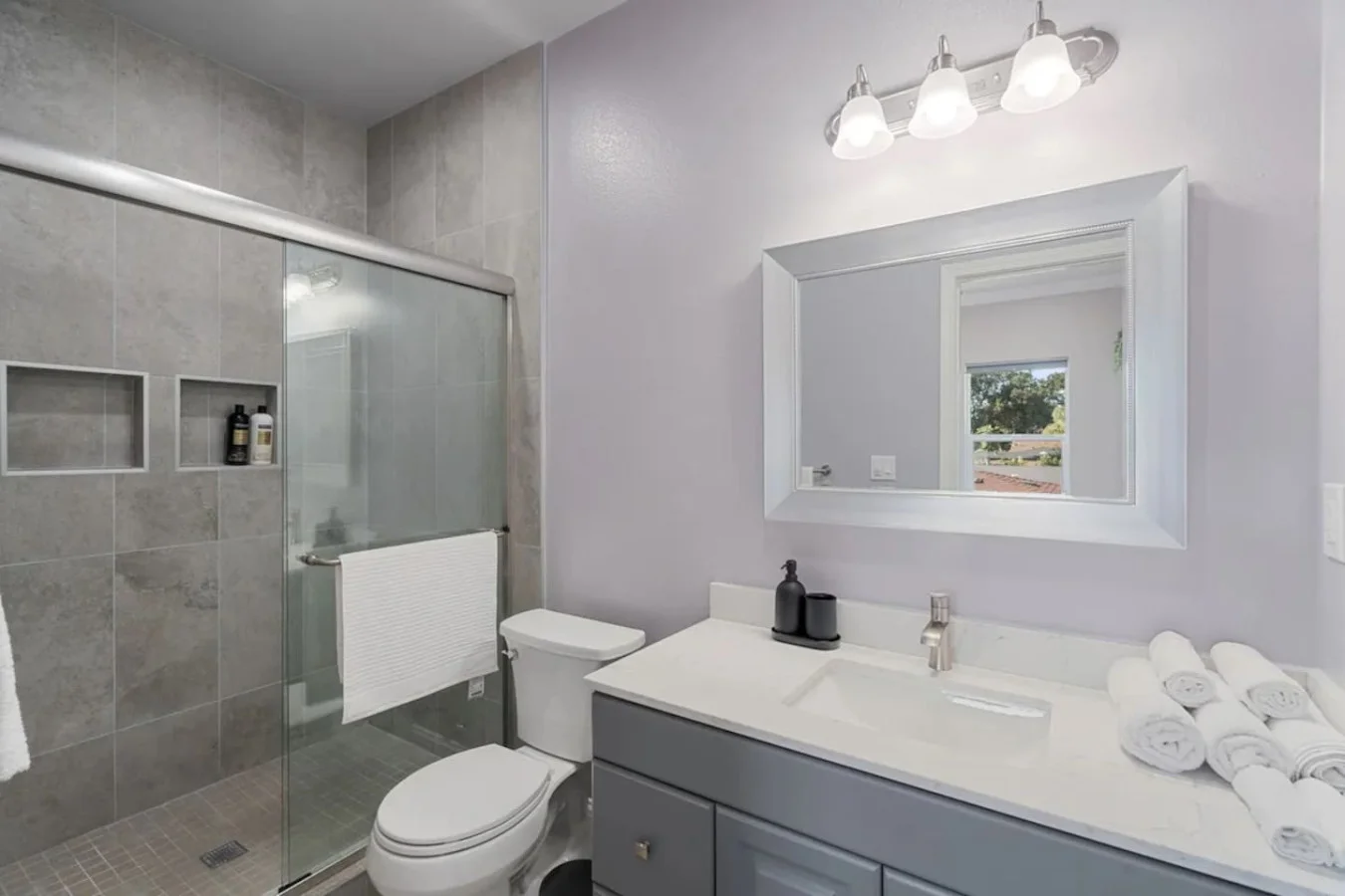 You feel a sense of calm as you enter the bathroom, where the thoughtful design and high-quality materials create a serene environment.