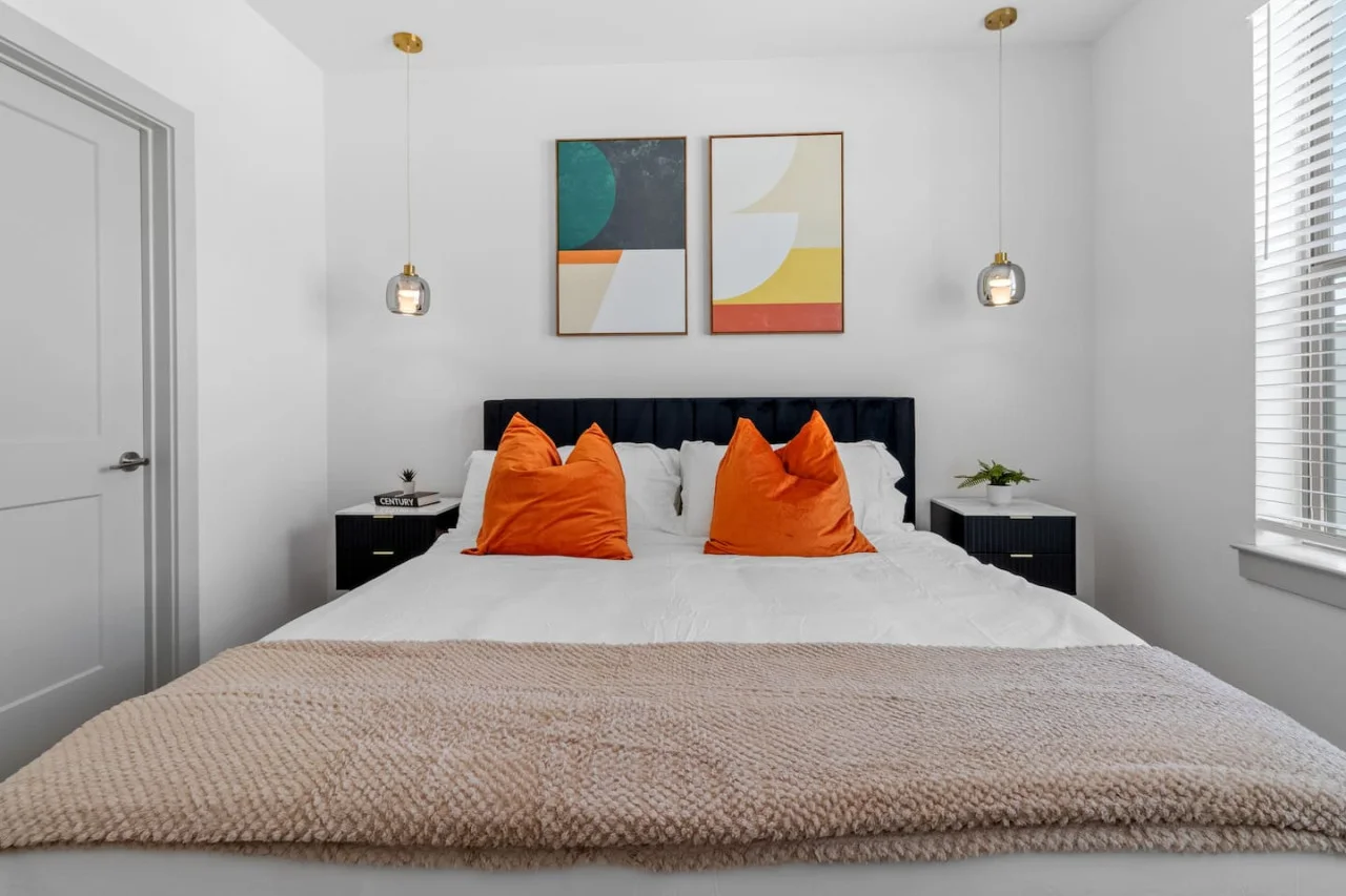The bedroom offers a luxurious retreat, with a bed that promises restful nights and a room that feels like a private oasis.