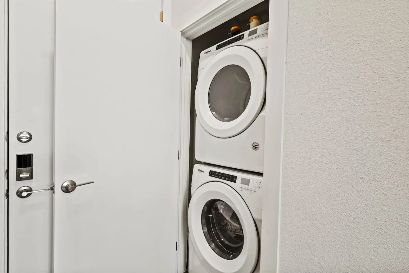 Laundry room with a washer, dryer, and folding area, offering all the convenience you need for a comfortable extended stay.