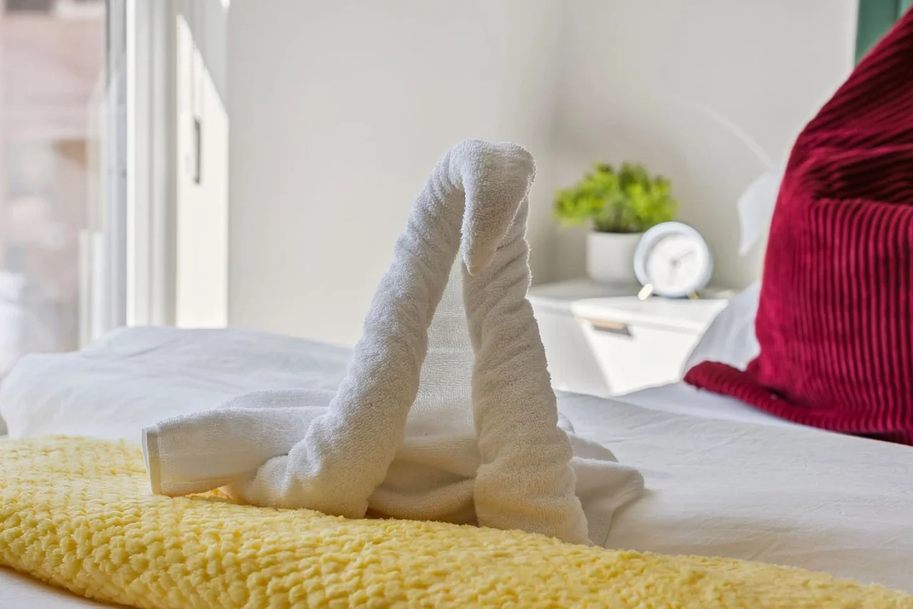 The queen bedroom’s stylish design and comfortable bedding create a perfect sanctuary for restful nights.