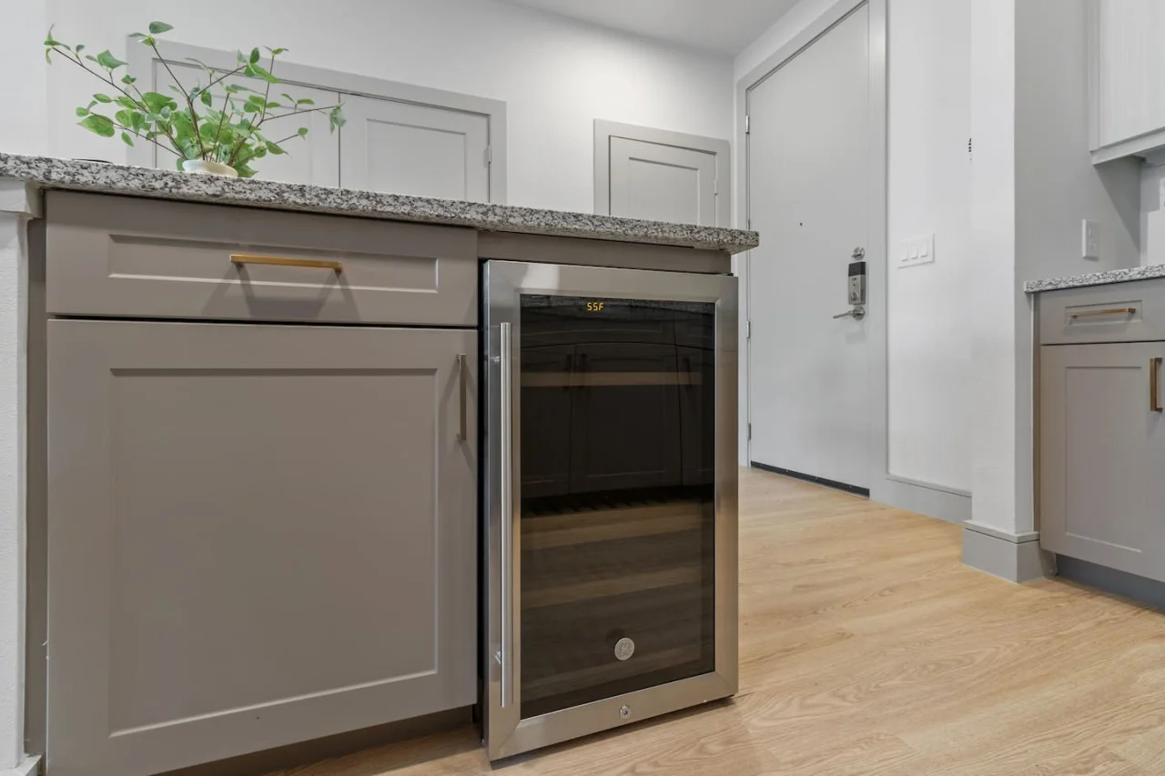 As you approach kitchen the elegant layout and well-stocked shelves make it the ideal spot to relax.