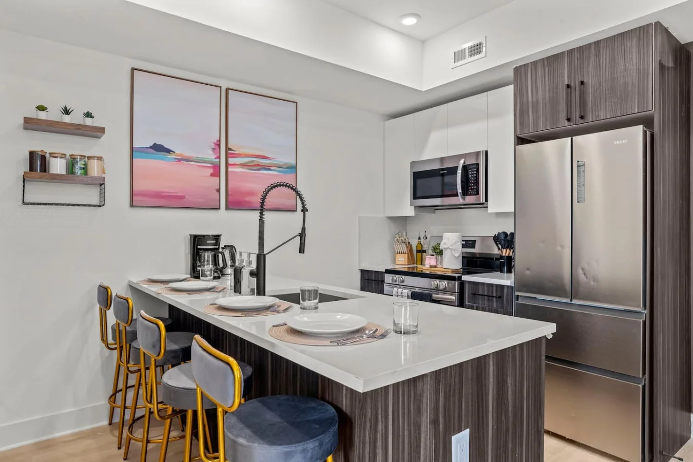 Fully Equipped Kitchen with Counter Height Seating for Four. Stainless steel appliances. Outlet on Island for Charging Devices / Working