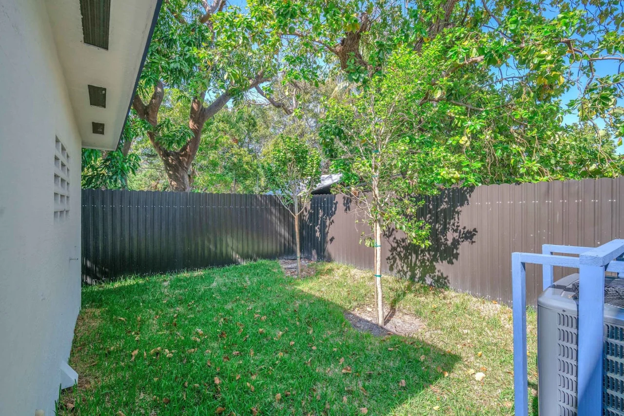 The backyard porch is filled with natural light, creating a bright and welcoming space that invites relaxation.