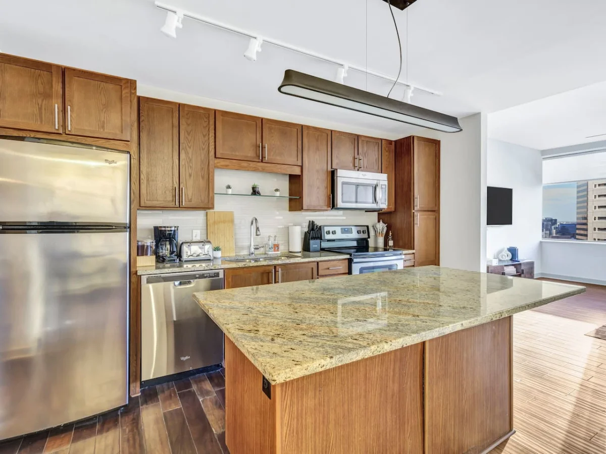 As you open the kitchen, you discover an assortment of coffee pods, and sugar, ensuring you have everything you need for a perfect morning or afternoon pick-me-up.