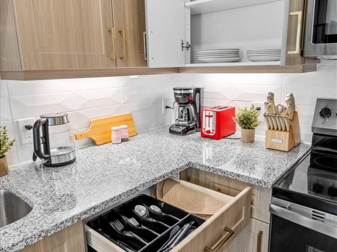 As you approach kitchen the elegant layout and well-stocked shelves make it the ideal spot to relax.