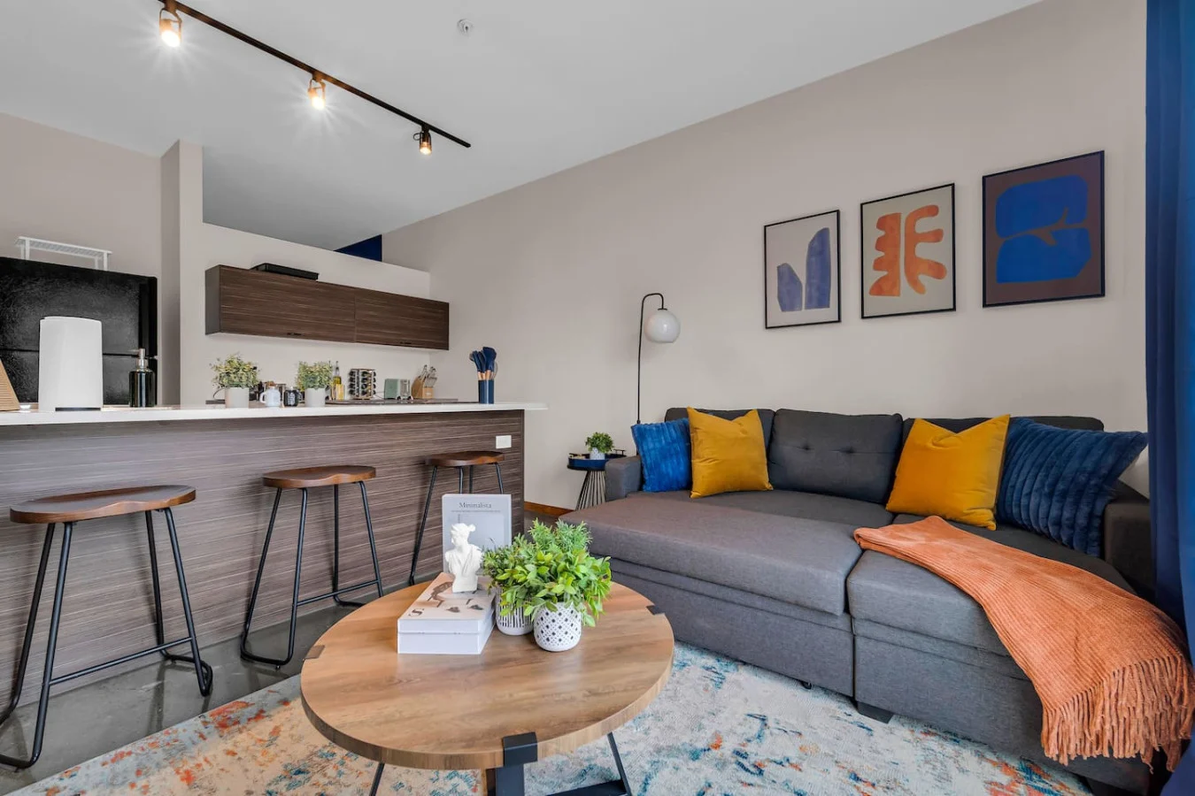 You feel at home as you settle into the living room, where the inviting atmosphere is perfect for lounging or entertaining.