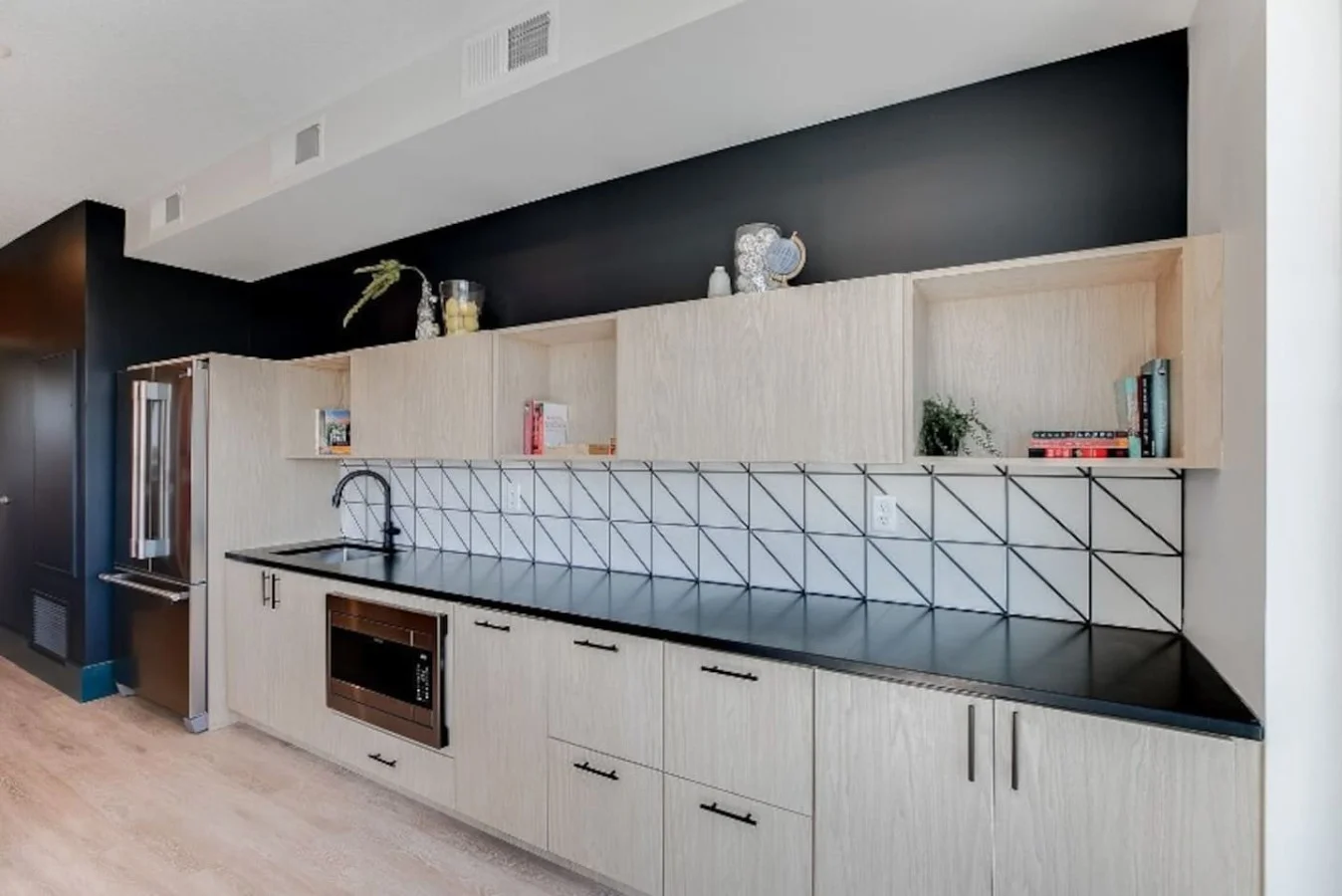 The kitchen’s open layout allows you to move freely as you prepare meals, with everything you need at your fingertips.