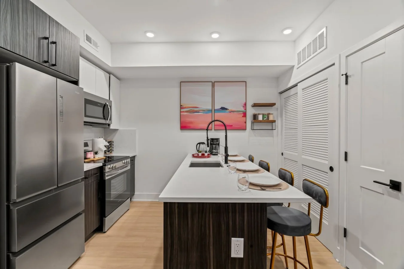 Fully Equipped Kitchen with Brand New Stainless Steel Appliances. Counter Height Dining for Four.