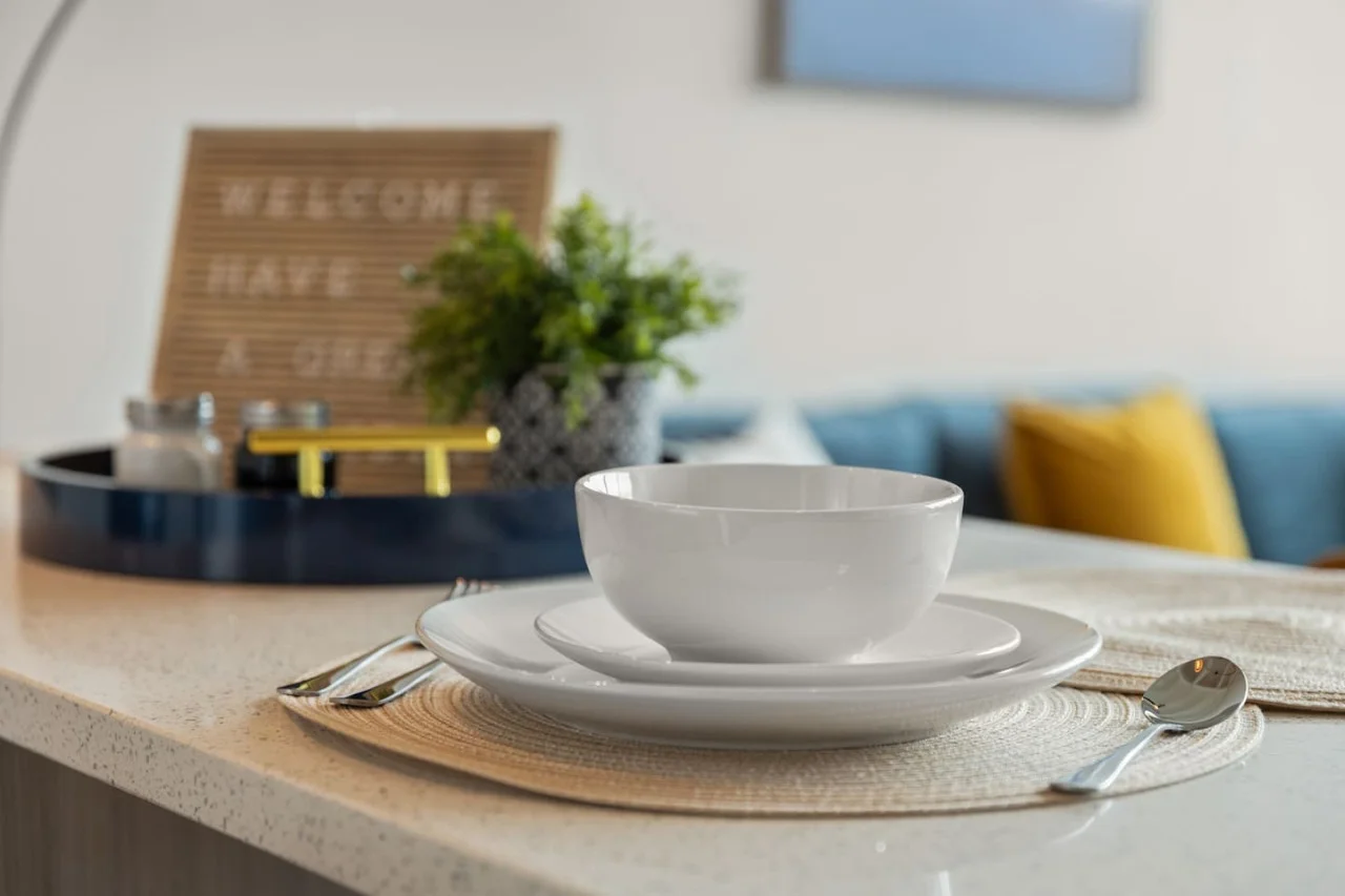 The coffee station is thoughtfully equipped with a variety of in-house consumables, including a selection of ground coffee, sweeteners, and creamers to suit every taste.
