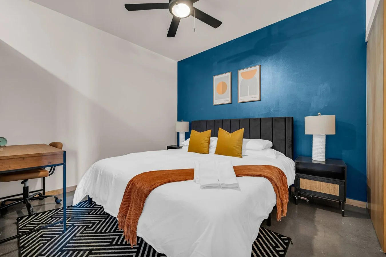 The bedroom’s serene ambiance invites you to relax, with a plush bed that promises a restful night's sleep.