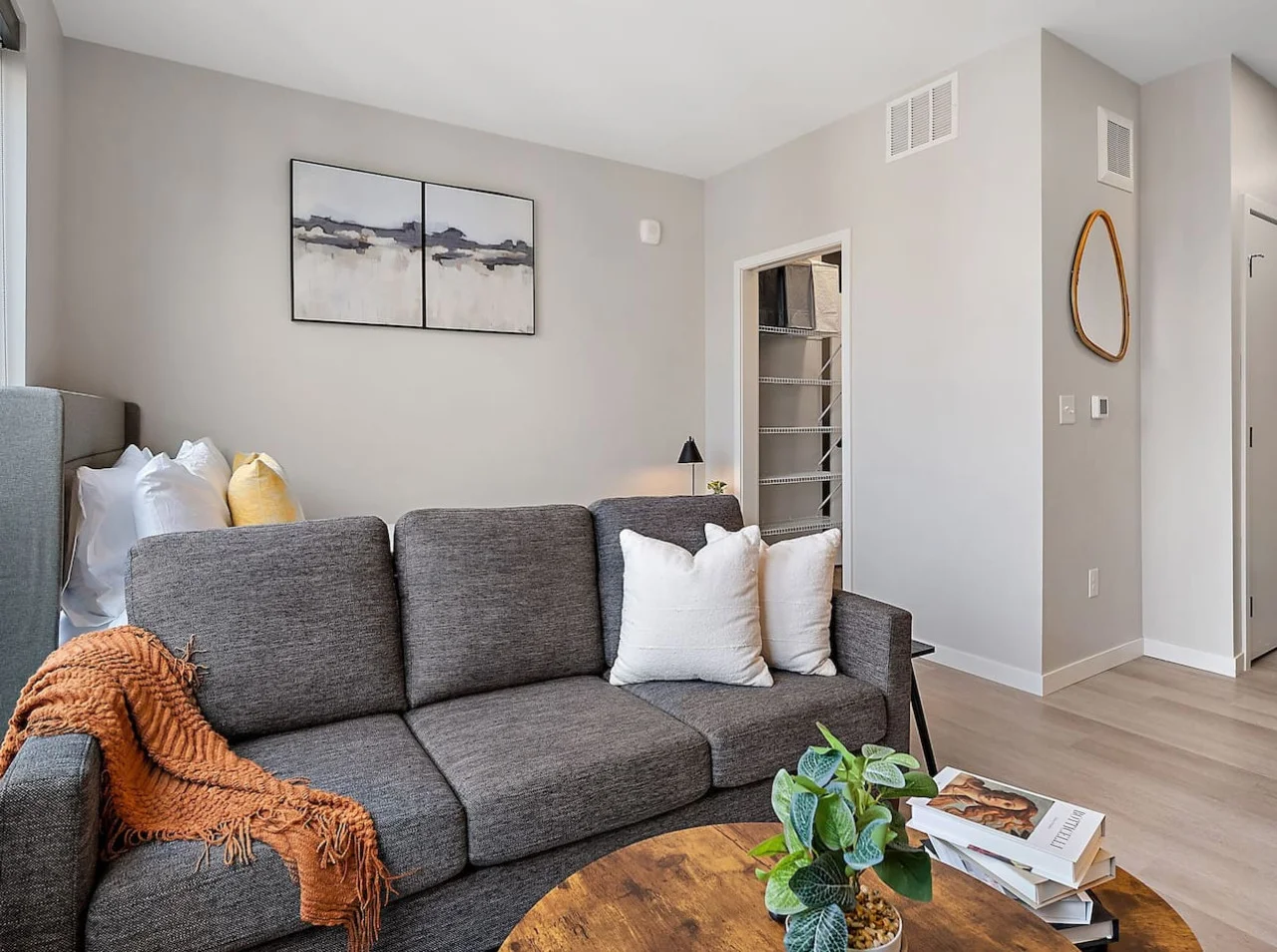 You feel a sense of peace as you step into the living room , with its inviting decor and soothing tones.