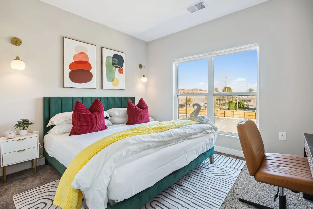 The king bed is the centerpiece of the room, offering a plush and inviting space where you can rest and recharge.
