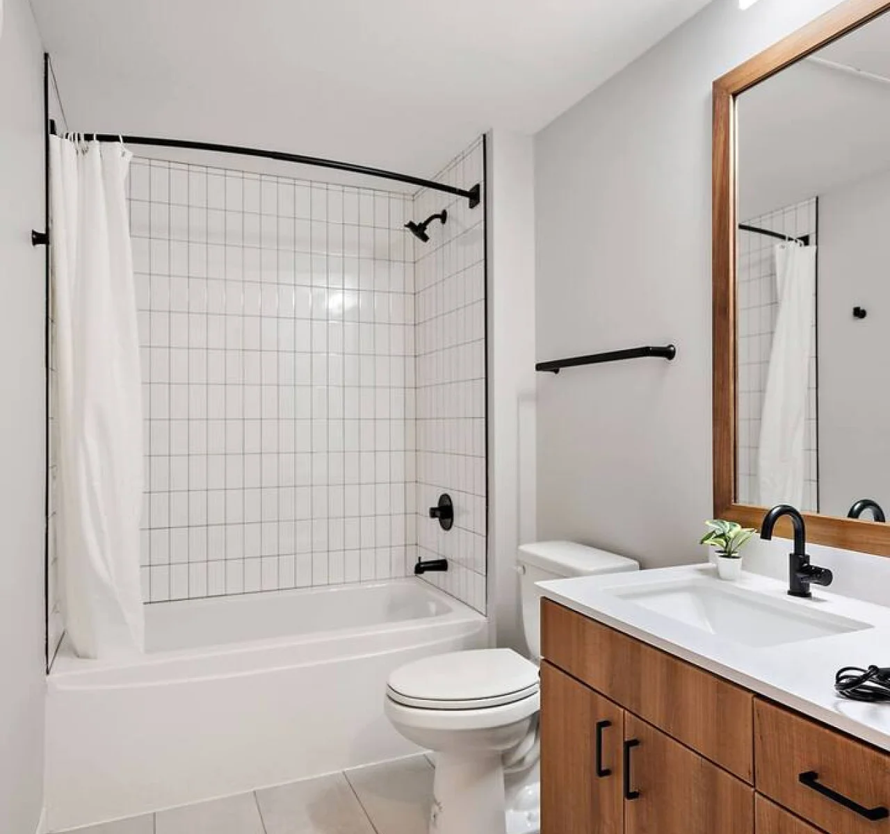 You feel a sense of calm as you enter the bathroom, where the thoughtful design and high-quality materials create a serene environment.