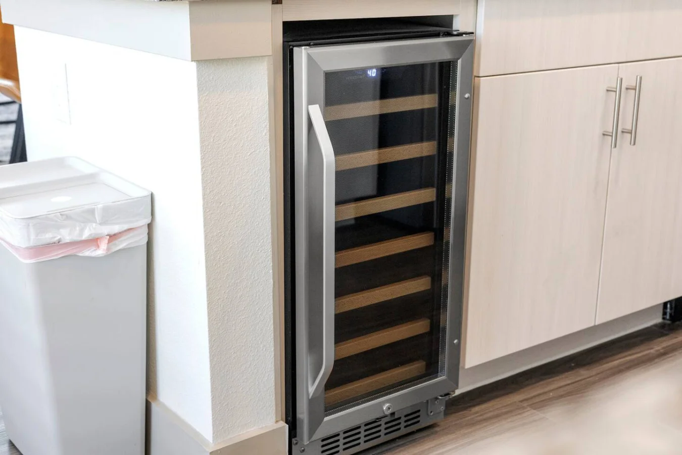 A well eqipped modern cabinetry, open shelving, and stylish lighting.