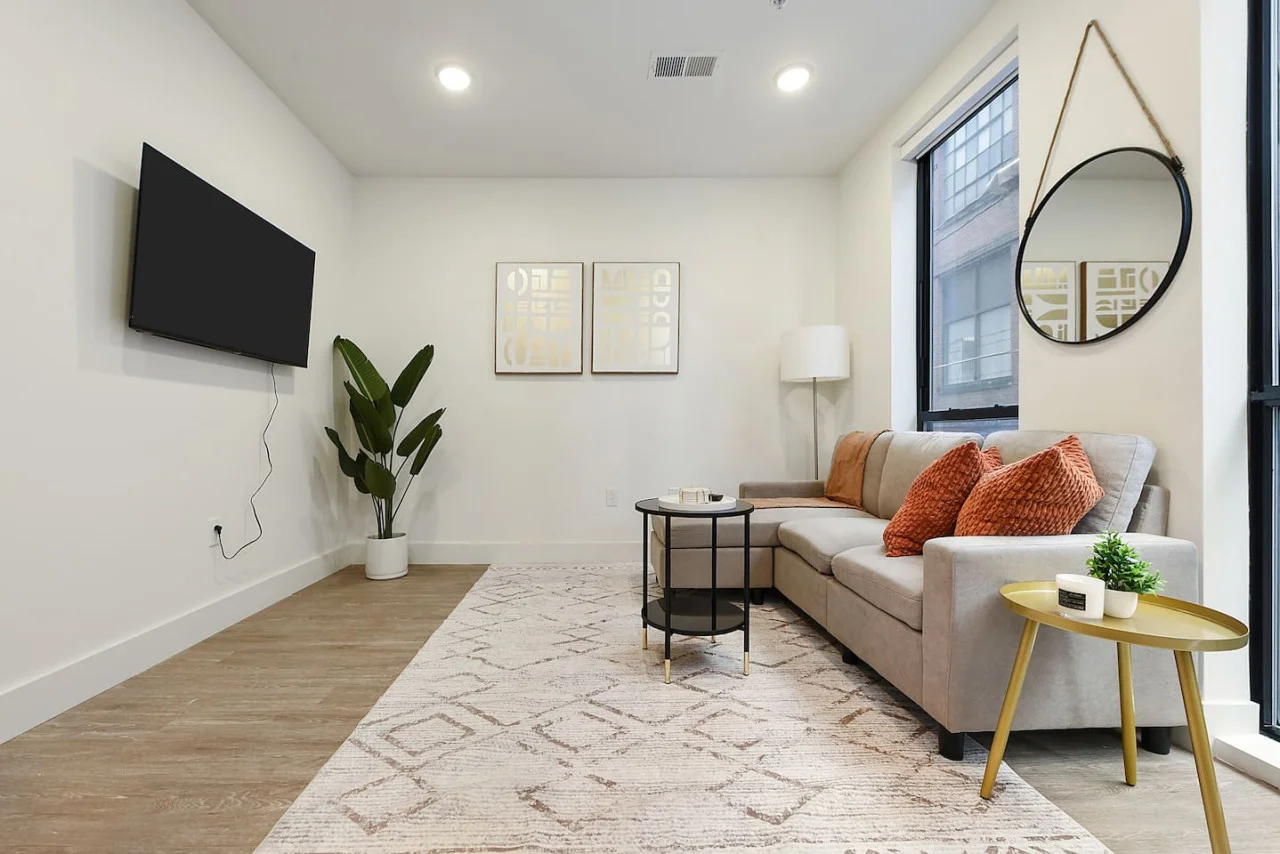 You feel at home as you settle into the living room, where the inviting atmosphere is perfect for lounging or entertaining.
