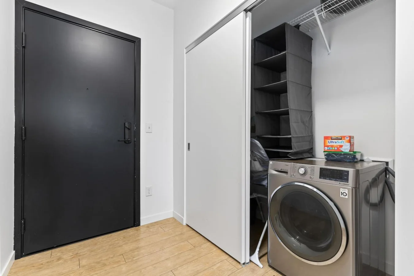 Laundry room with a washer, dryer, and folding area, offering all the convenience you need for a comfortable extended stay.