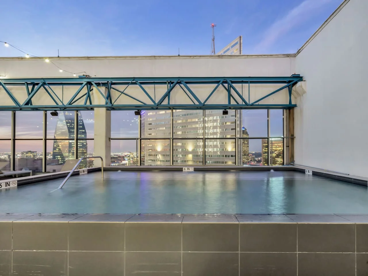 You can imagine yourself lounging by the pool, surrounded by greenery and the gentle sound of water.