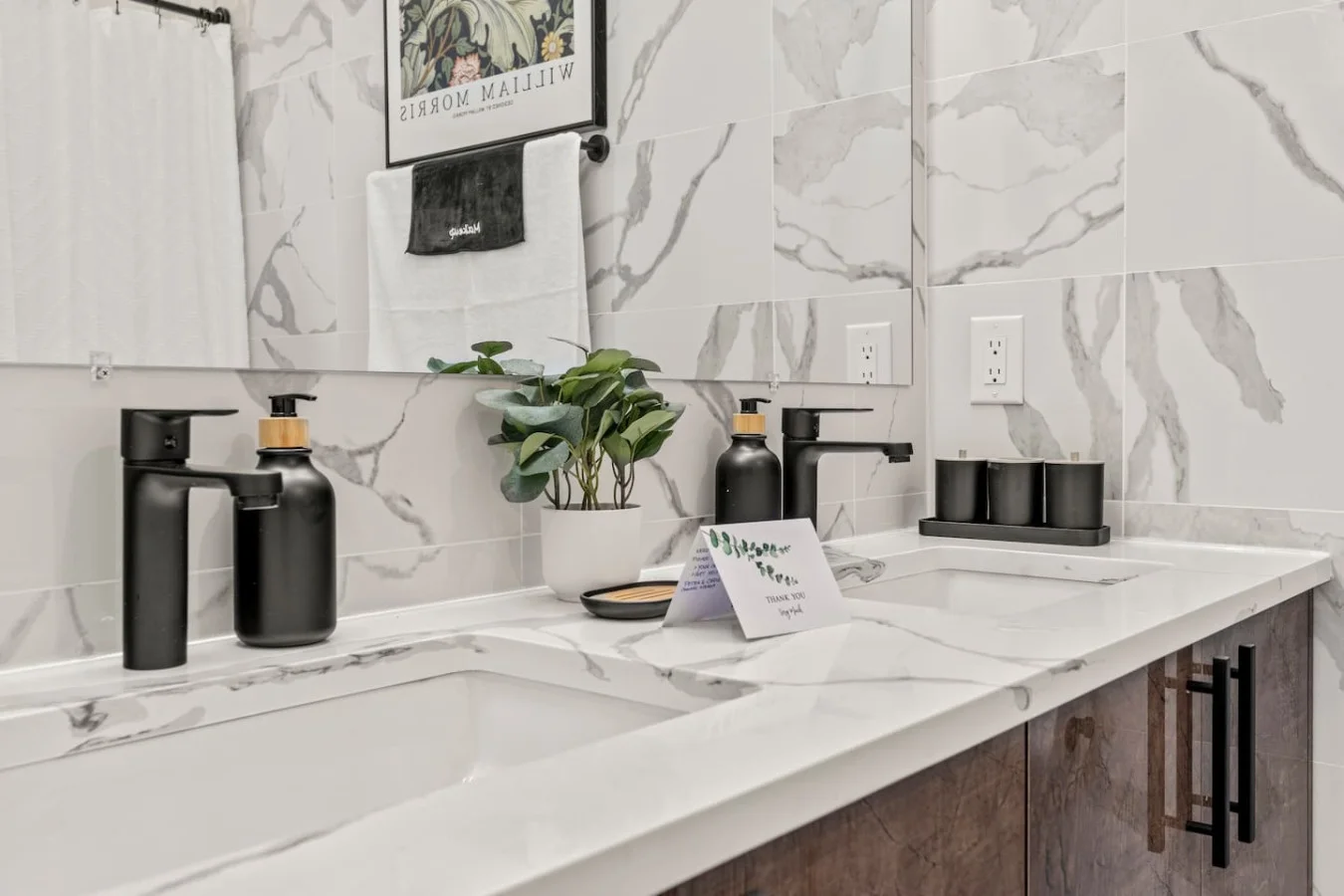 You feel a sense of calm as you enter the bathroom, where the thoughtful design and high-quality materials create a serene environment.