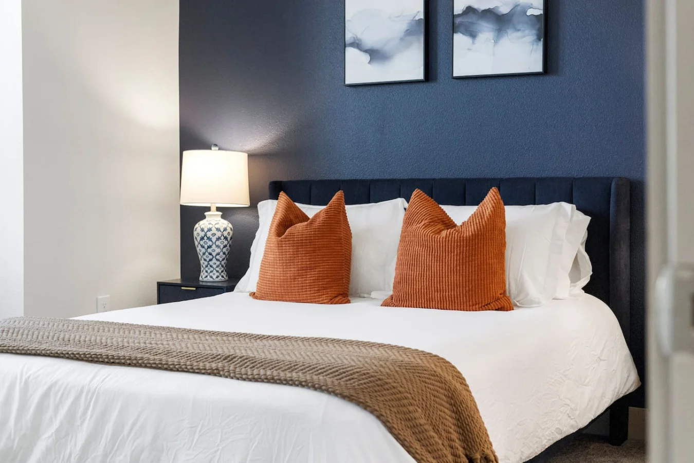The bedroom offers a luxurious retreat, with a bed that promises restful nights and a room that feels like a private oasis.