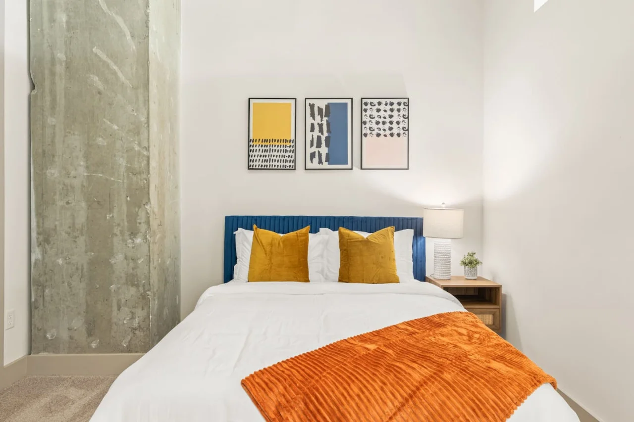 Rest comfortably in this spacious bedroom featuring two cozy queen beds, stylish decor, and plenty of natural light. Perfect for families or friends traveling together.